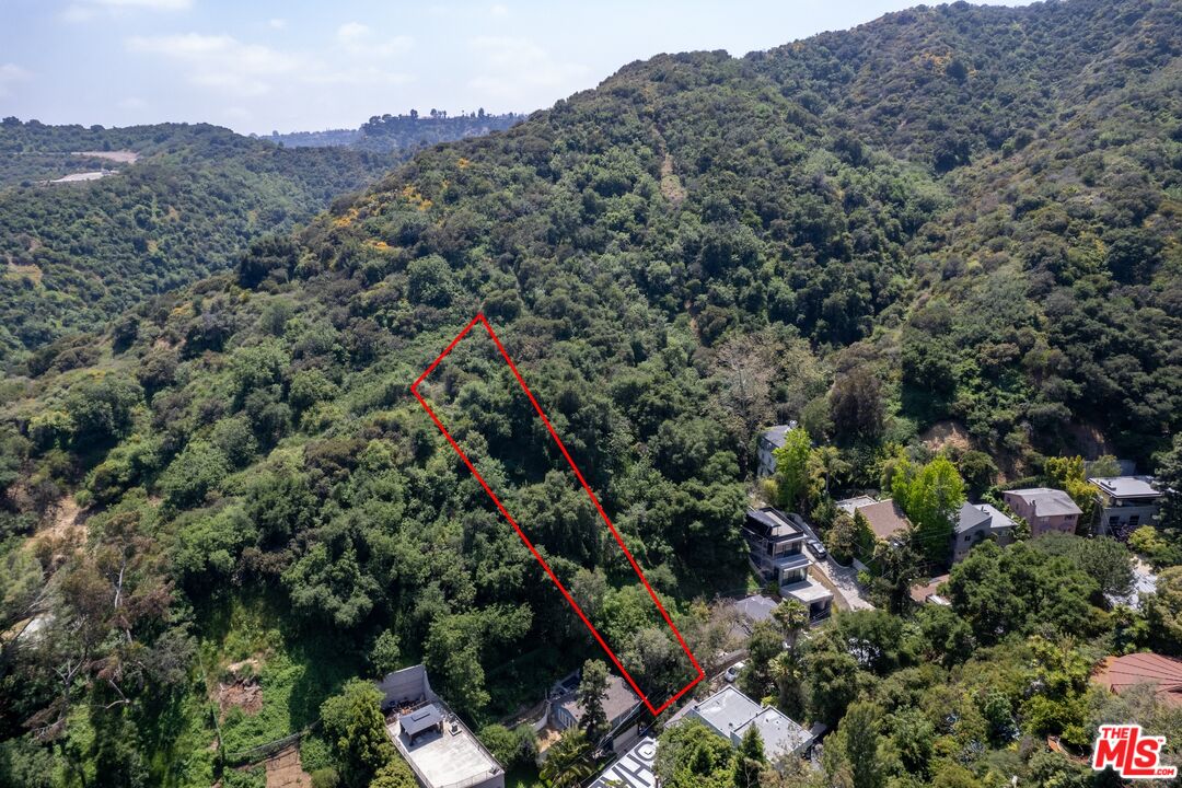 an aerial view of residential house with outdoor space