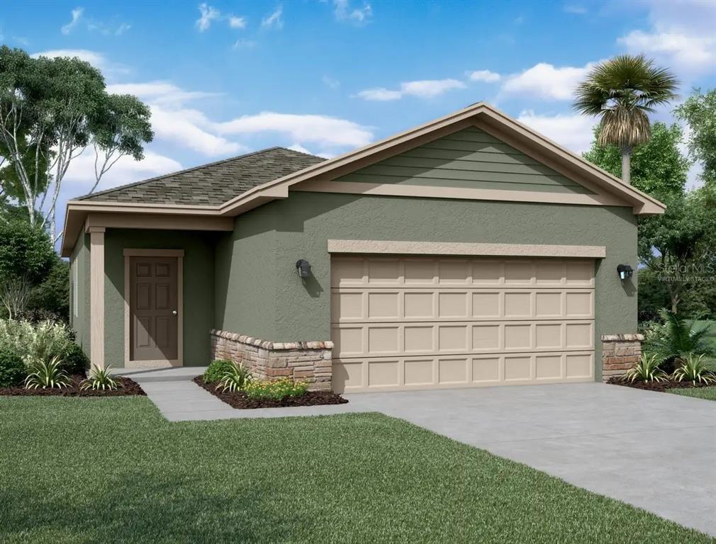 a front view of a house with a yard and garage