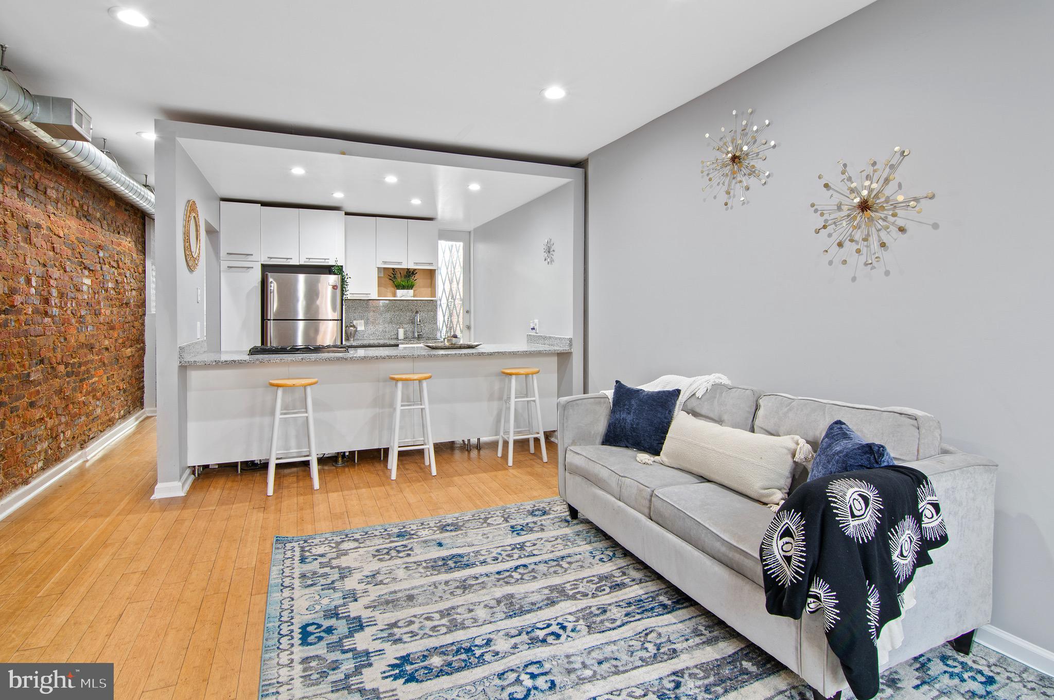 a living room with furniture and a table