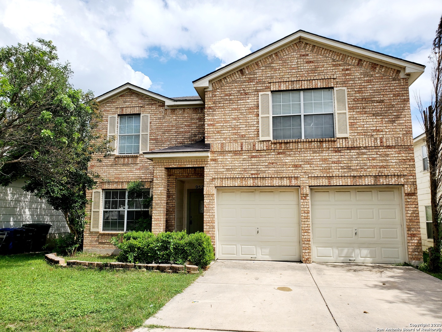 front view of a house with a yard