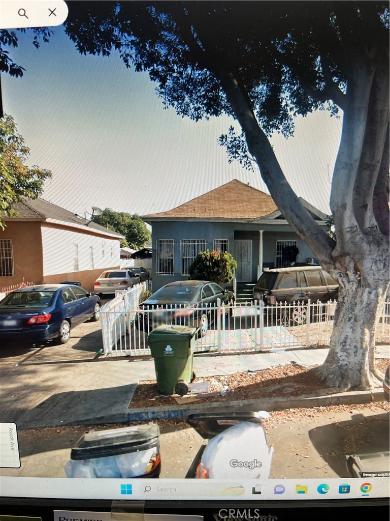 a view of house with outdoor space and sitting area