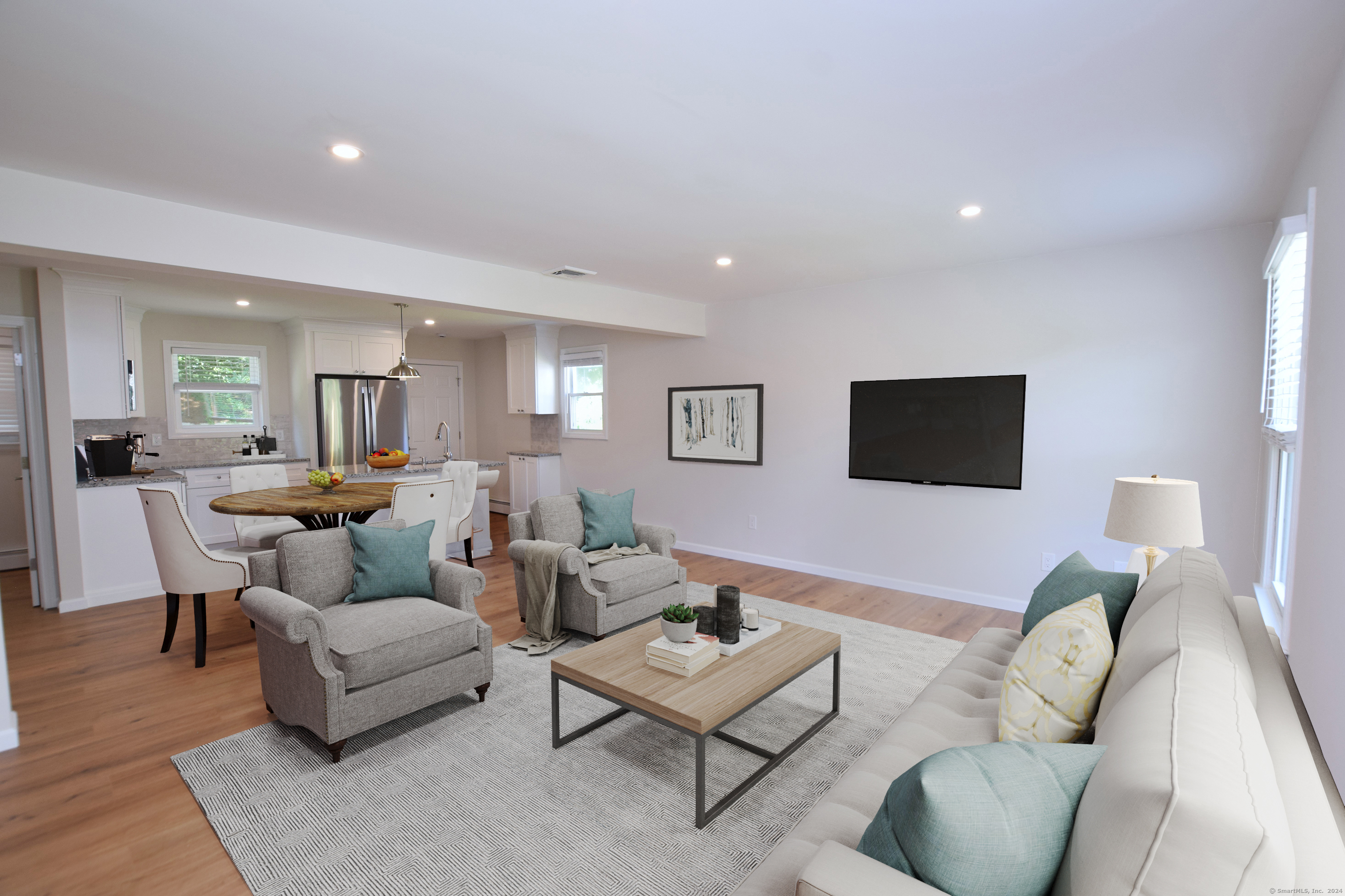 a living room with furniture and a flat screen tv