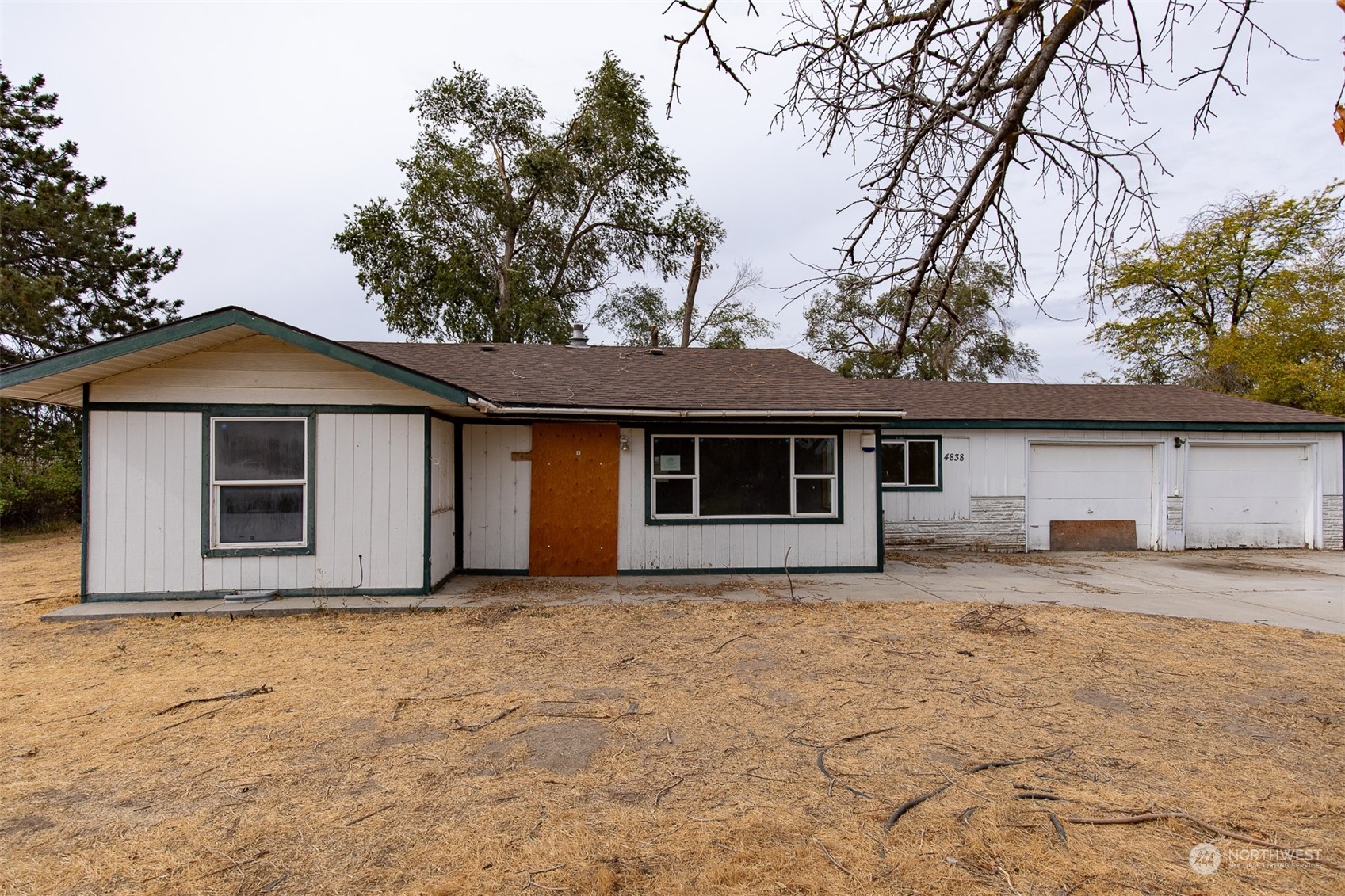 a house with trees in the background