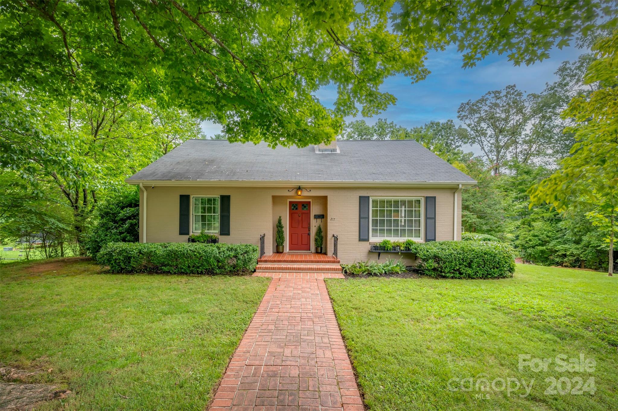 a front view of a house with yard