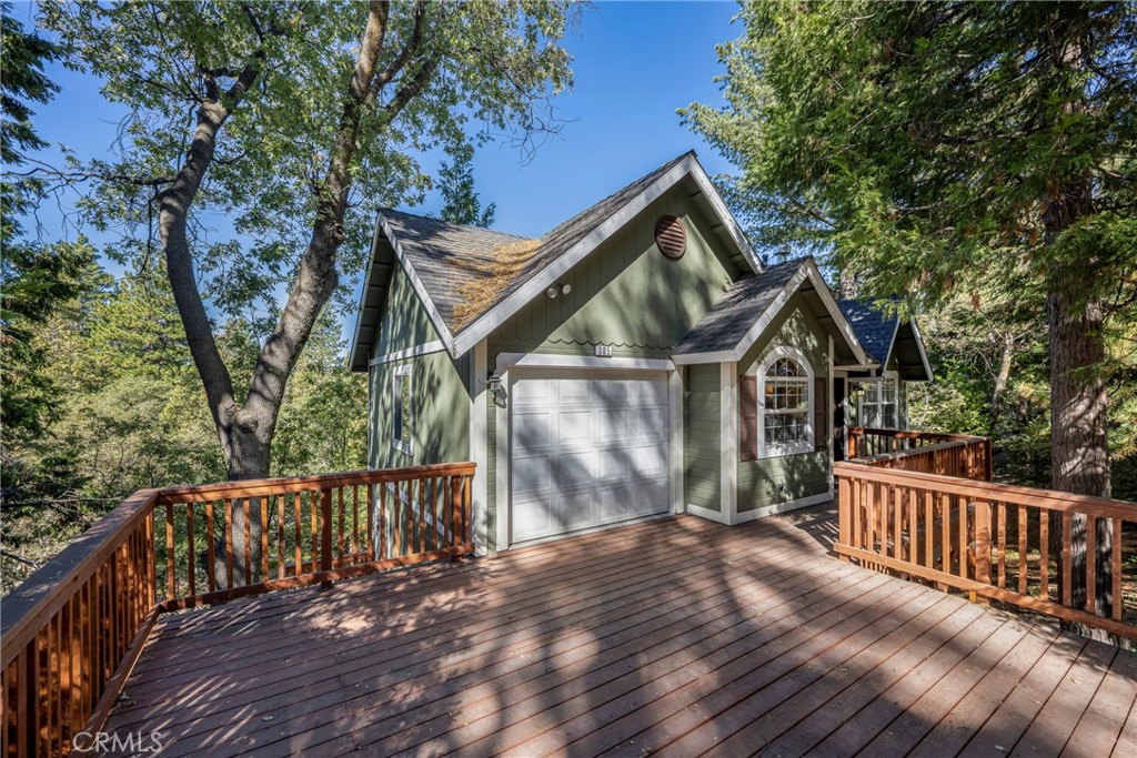 a view of a wooden deck and a yard