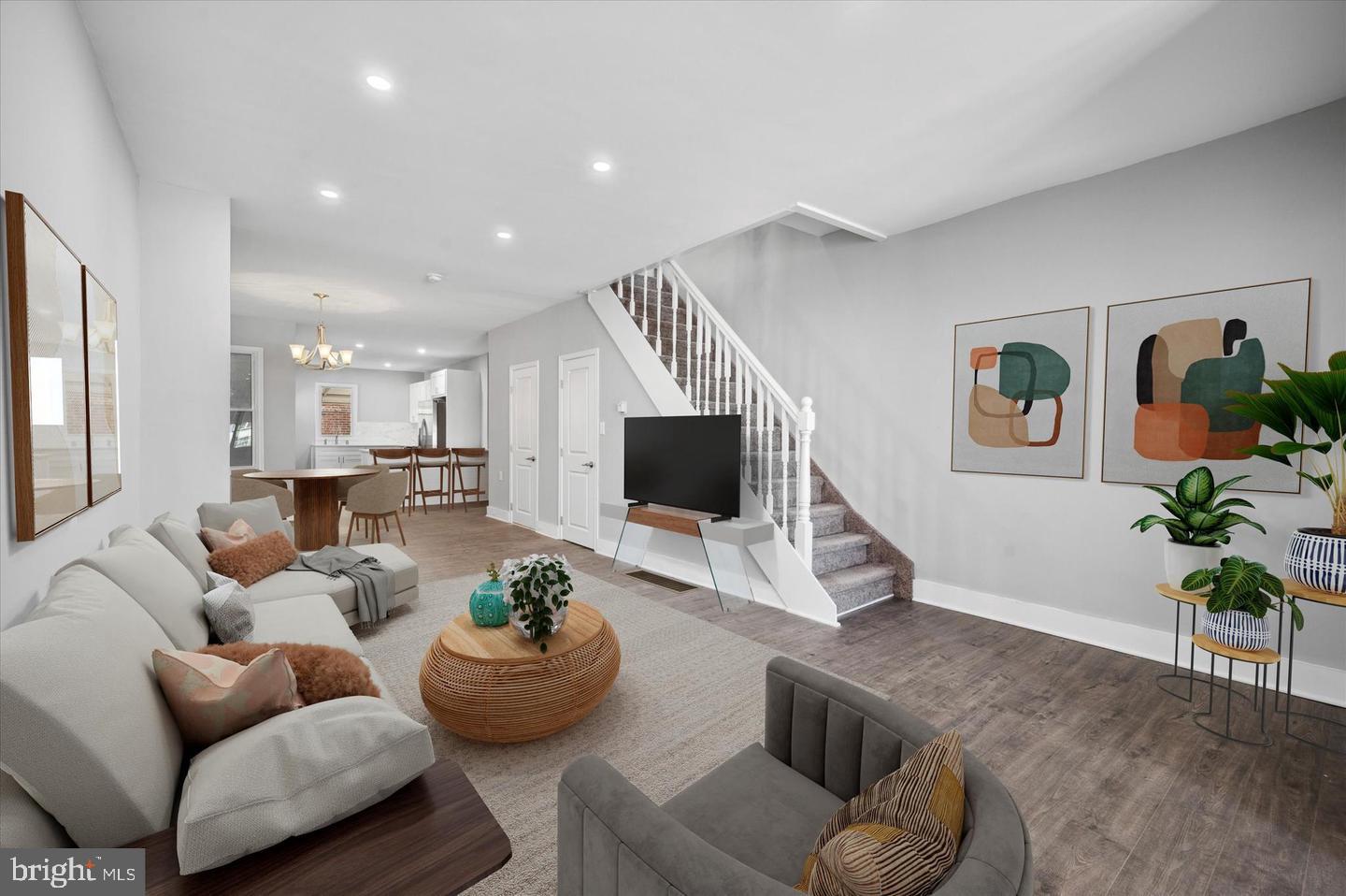 a living room with furniture and a flat screen tv