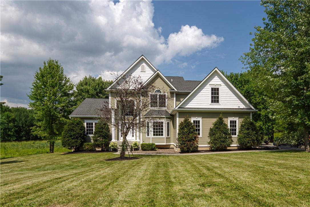 View of front of property with a front yard