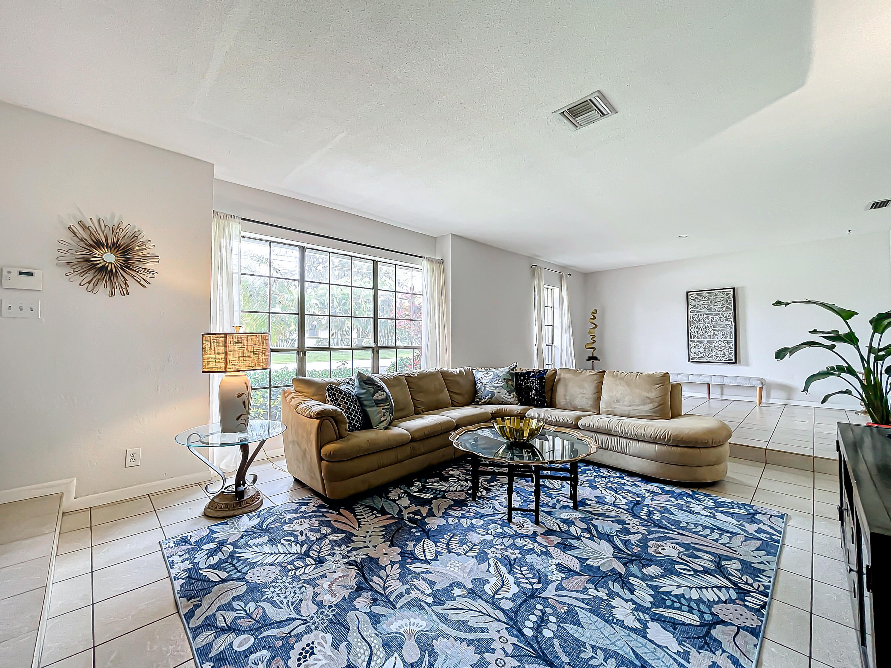 a living room with furniture and a rug