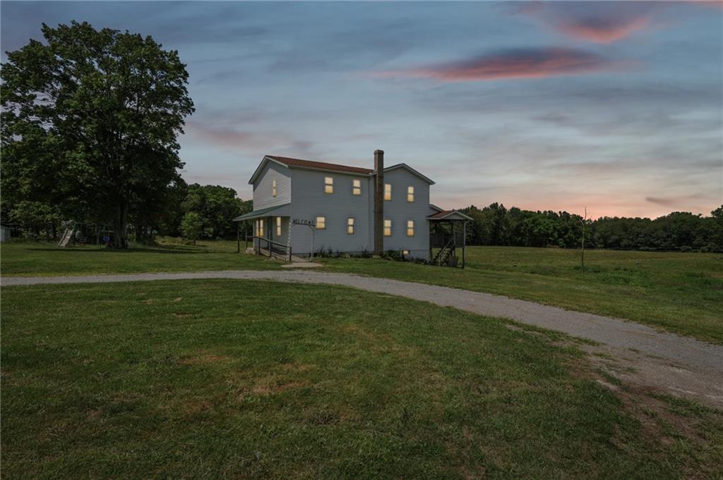 a view of a house with a big yard