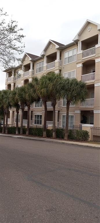 a front view of residential houses with yard