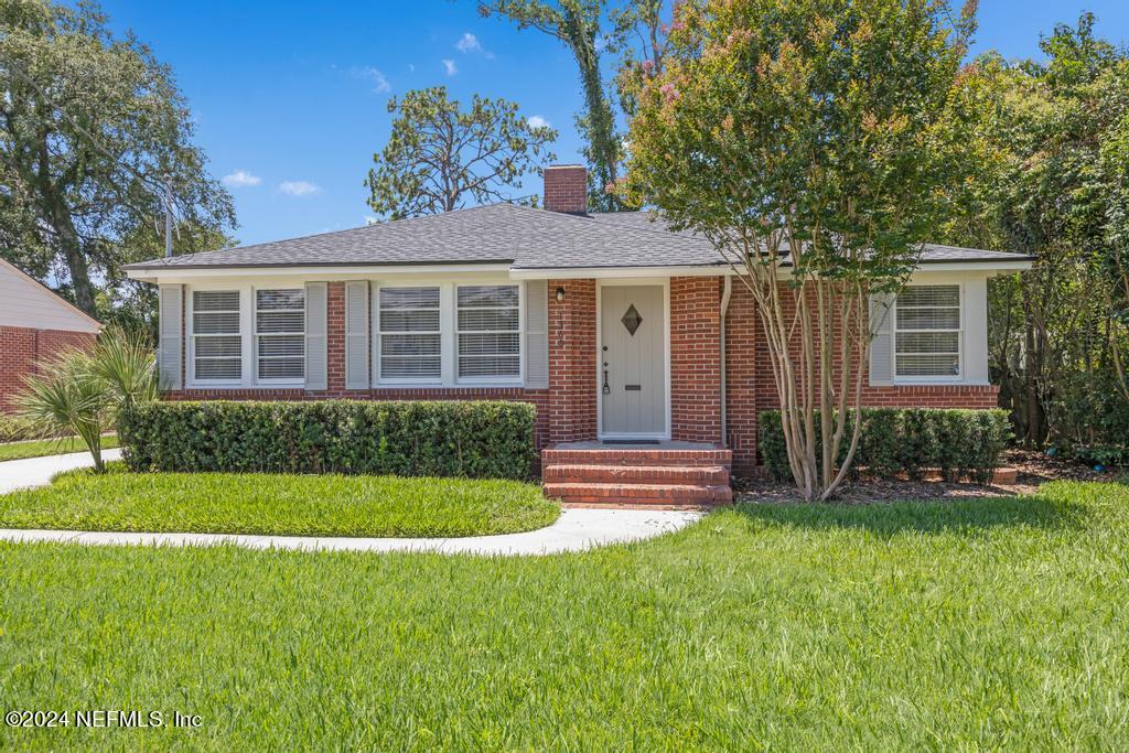 front view of a house with a yard