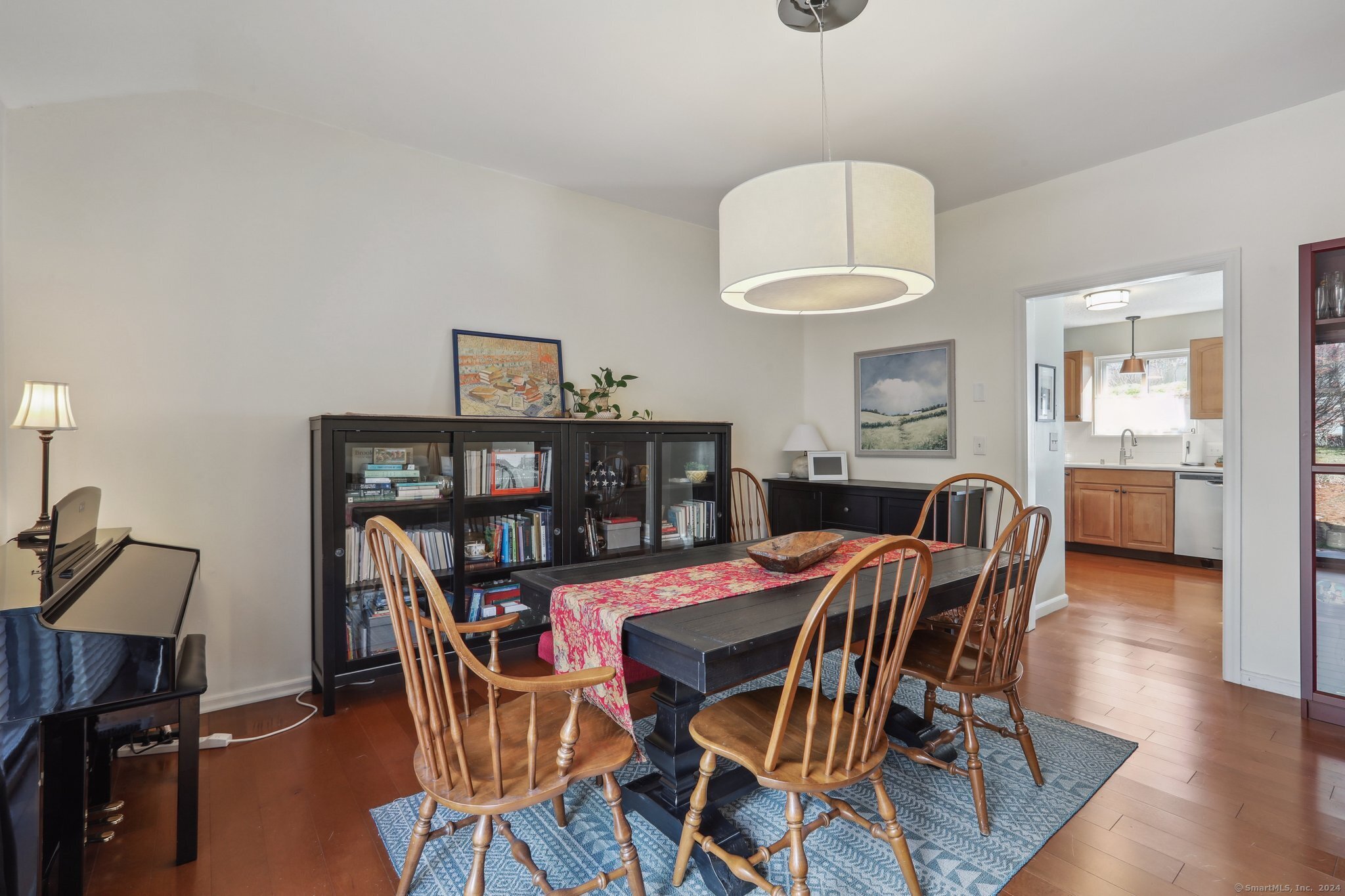 a dining room with furniture and window