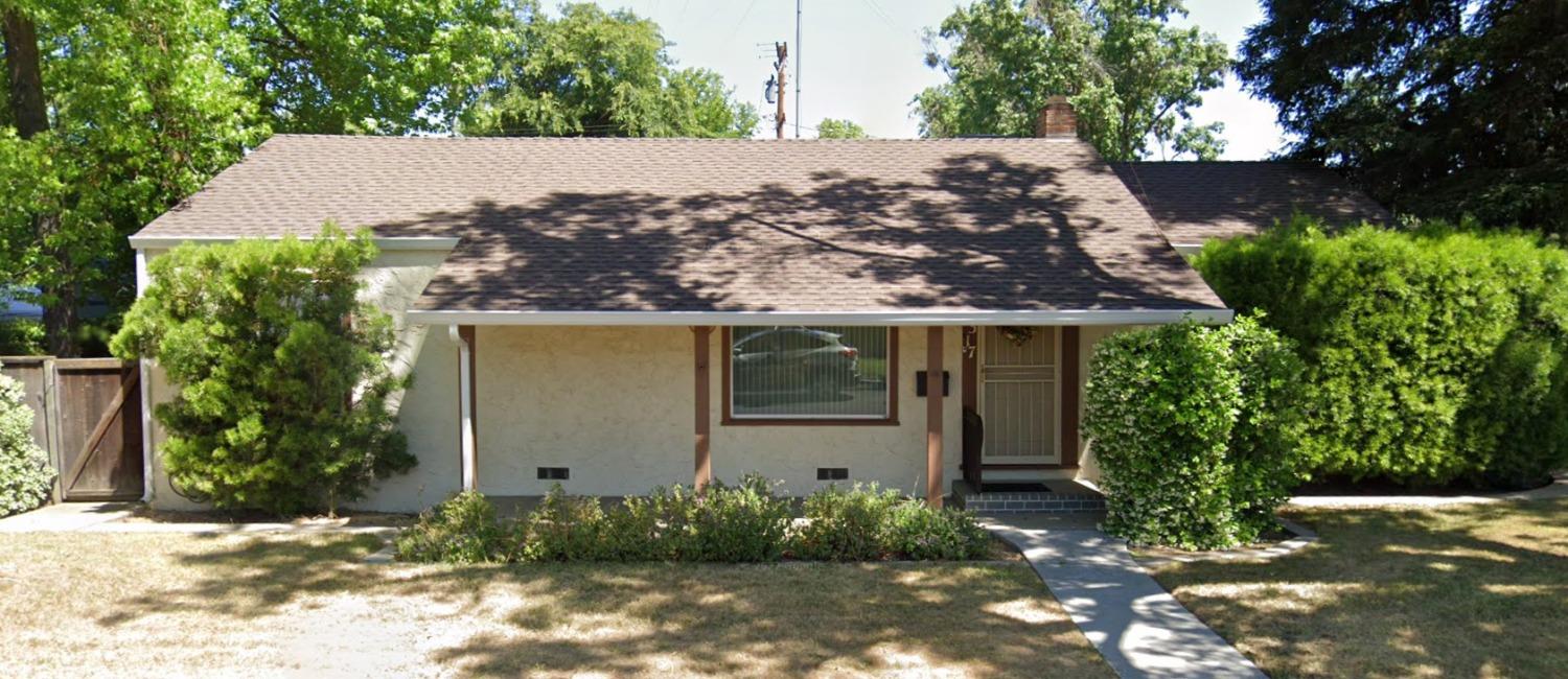 front view of a house with a yard