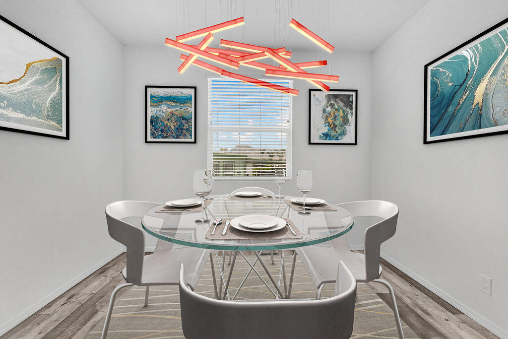 a dining room with furniture and window