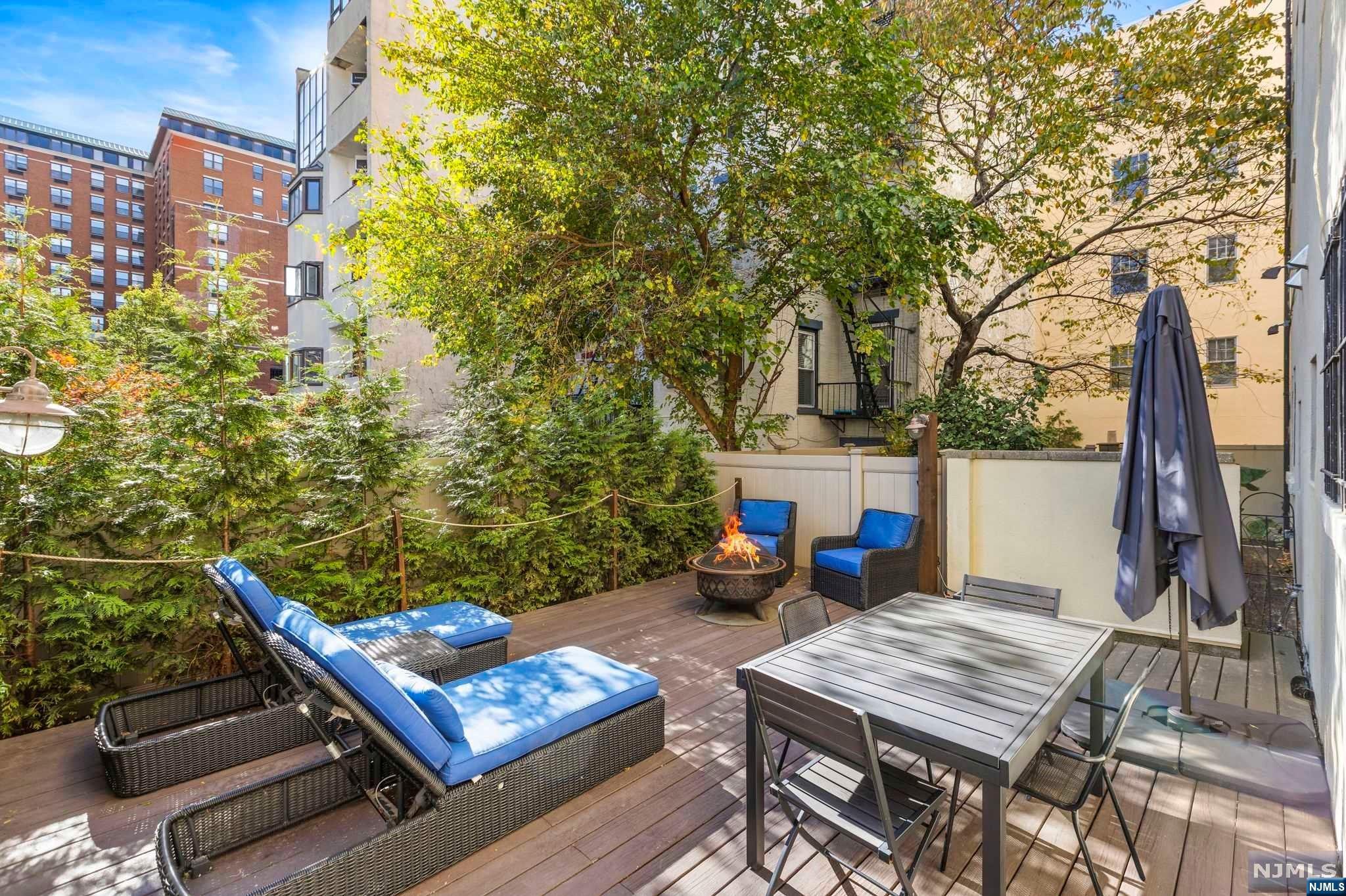 a view of outdoor sitting area with furniture