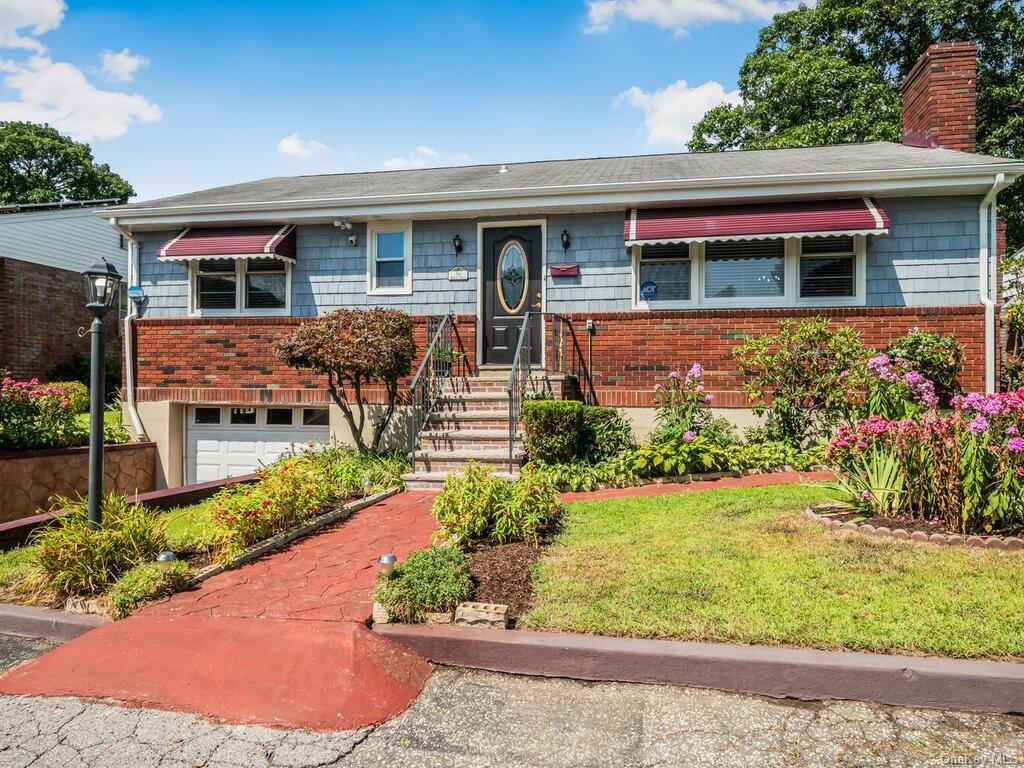 front view of a house with a yard