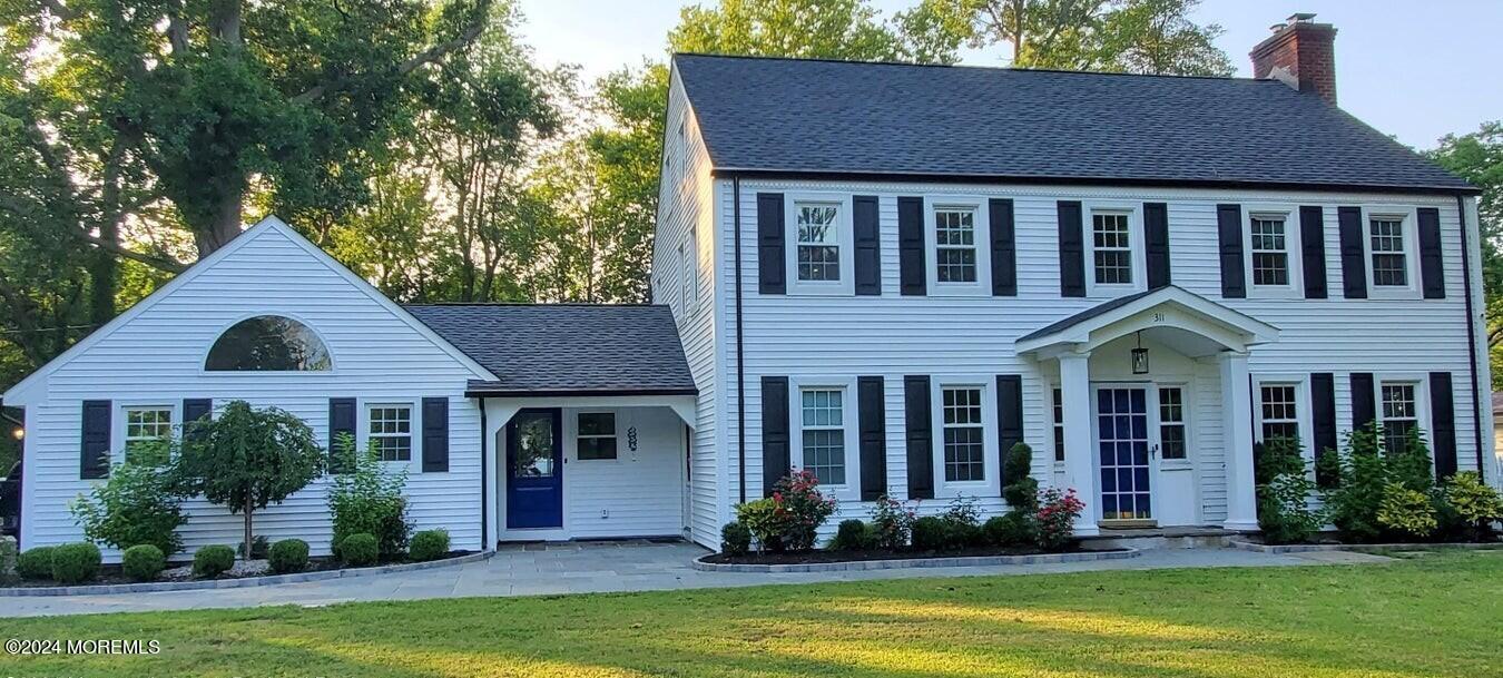 a front view of a house with yard