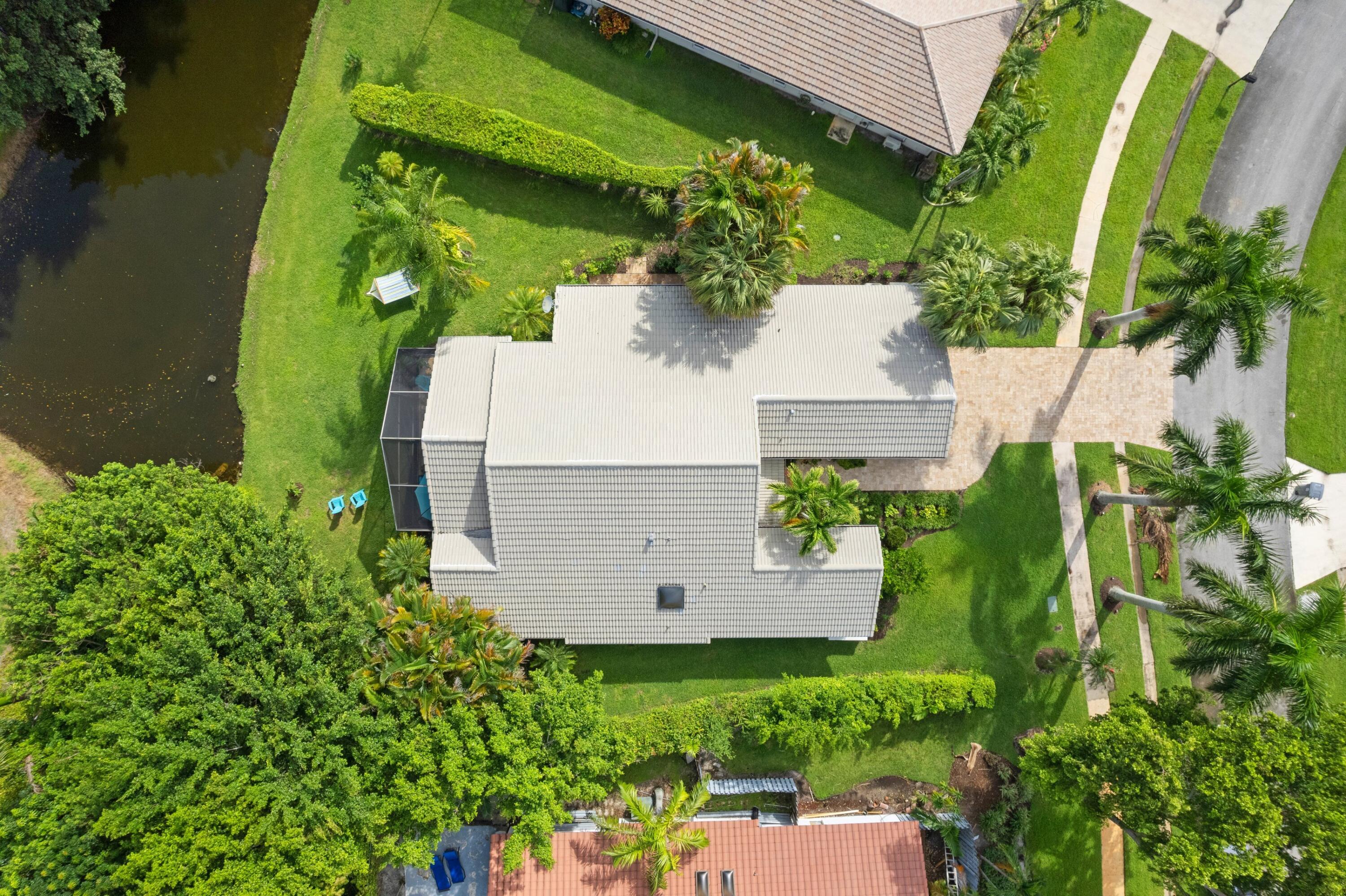 an aerial view of a house with a yard