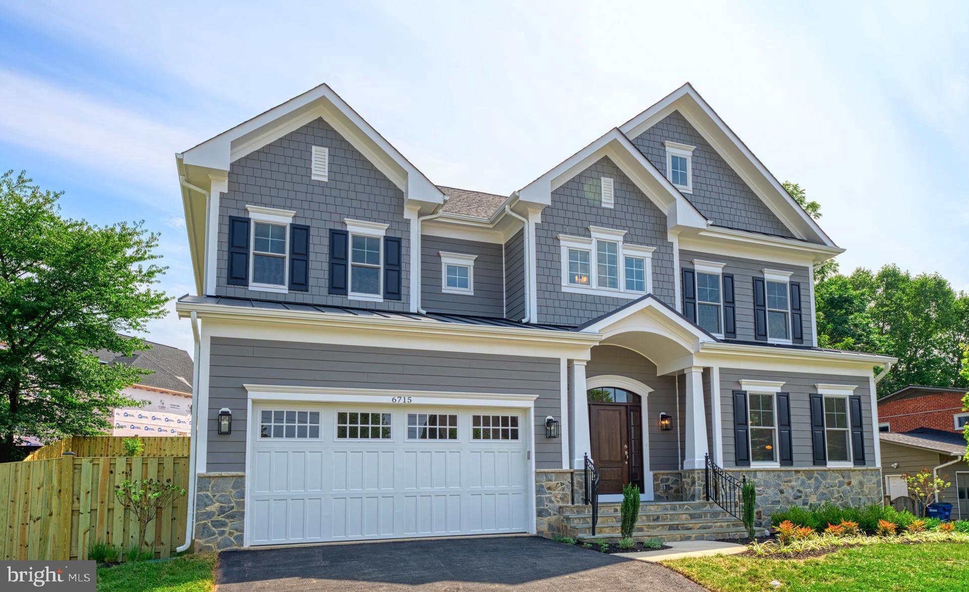 a front view of a house with yard