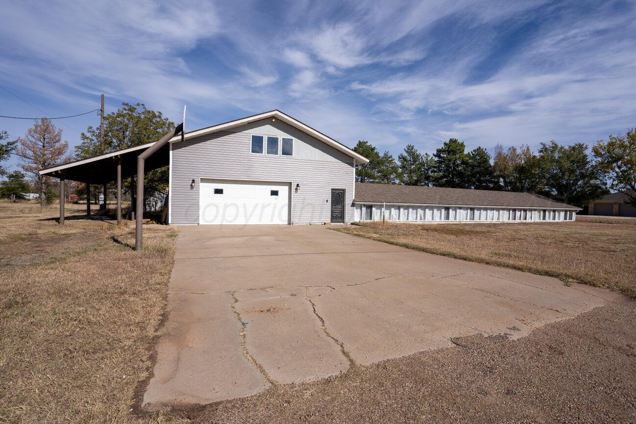 a view of a house with a big yard