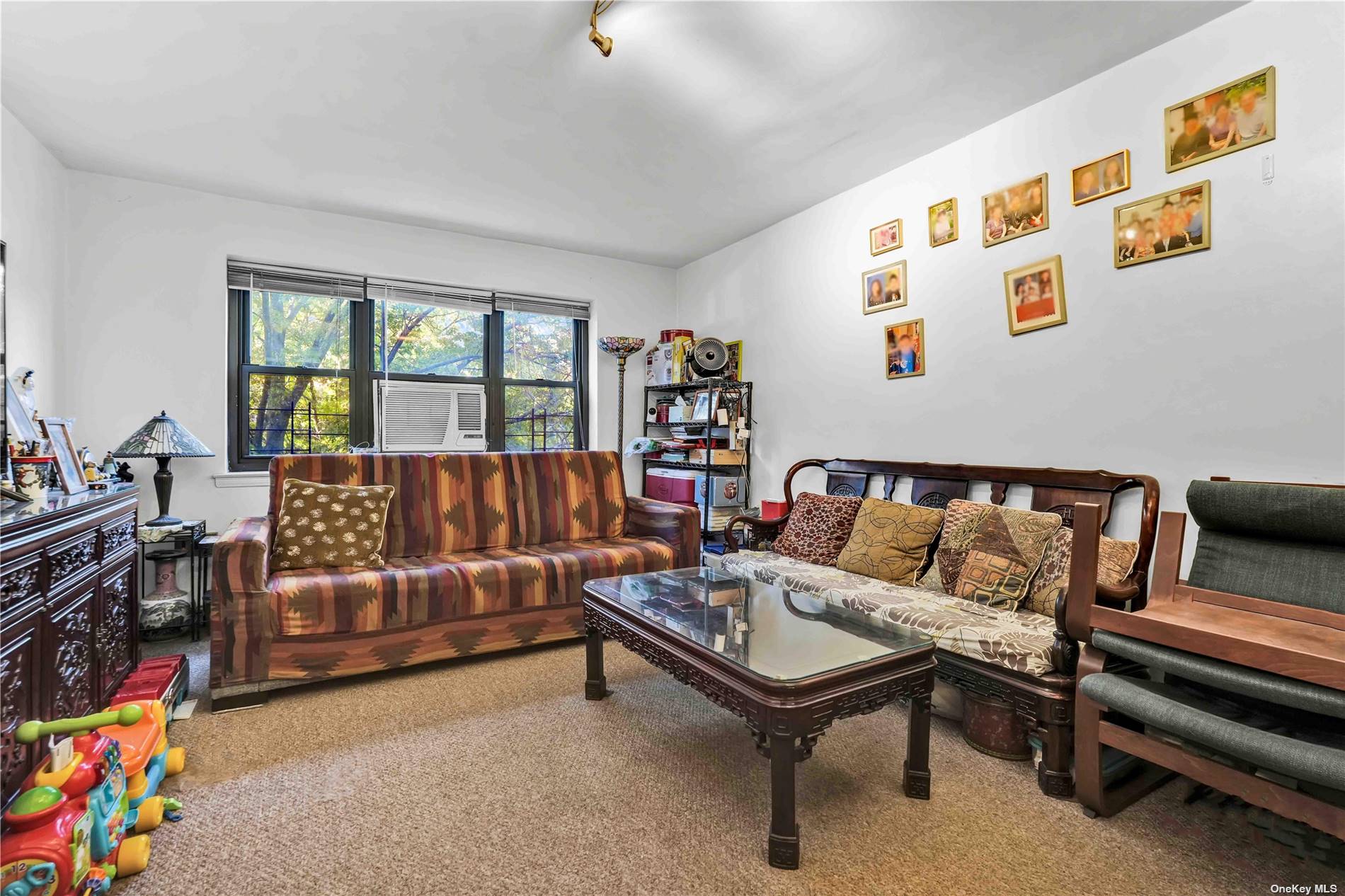 a bedroom with furniture and a wooden floor