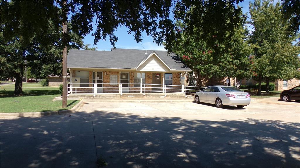 a house view with a sitting space and garden