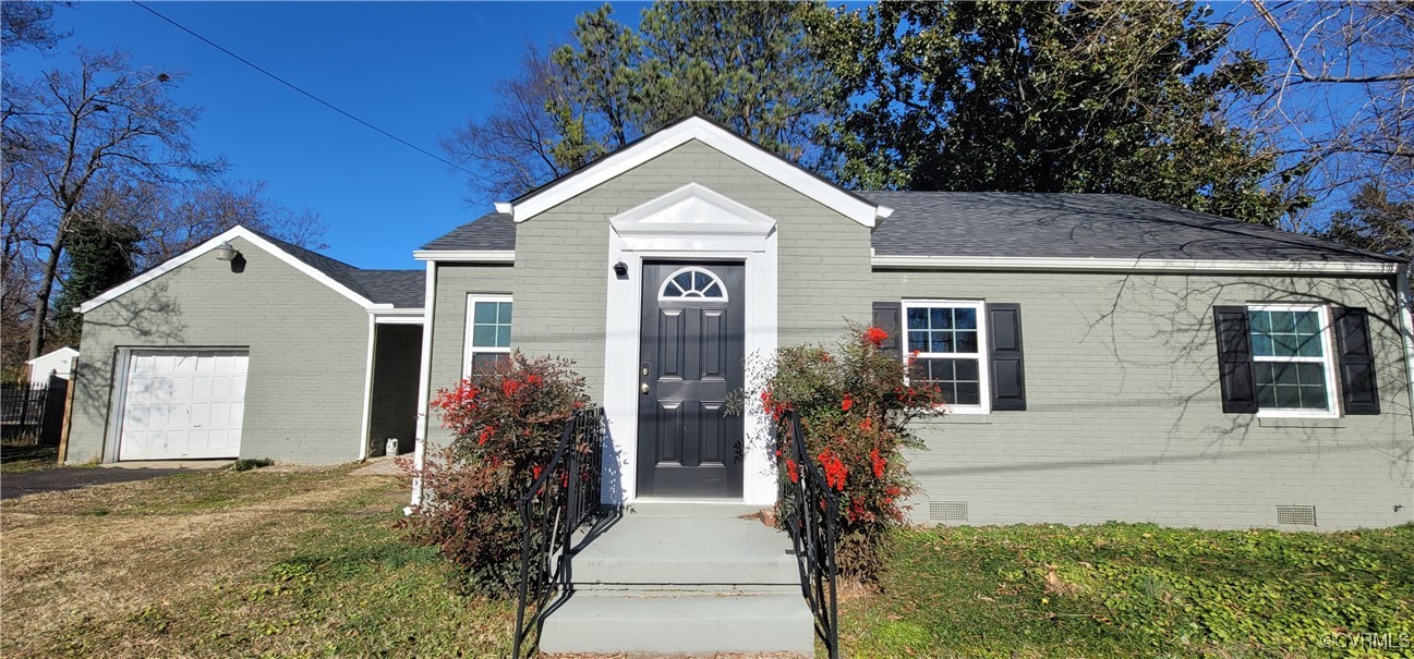 View of front of property with a front yard and a