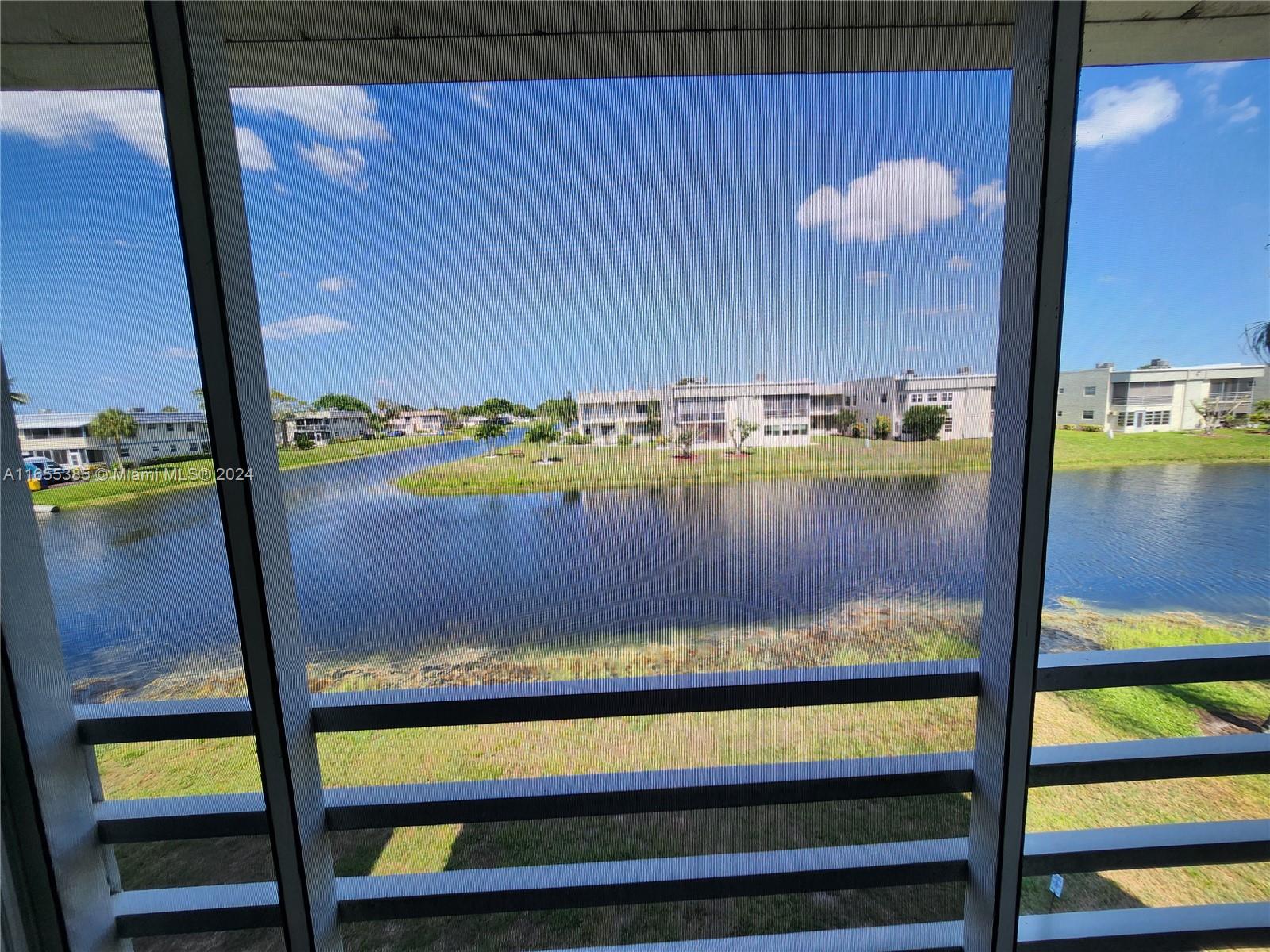 a view of swimming pool from a balcony