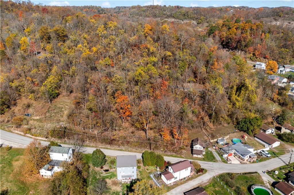 an aerial view of residential house with outdoor space