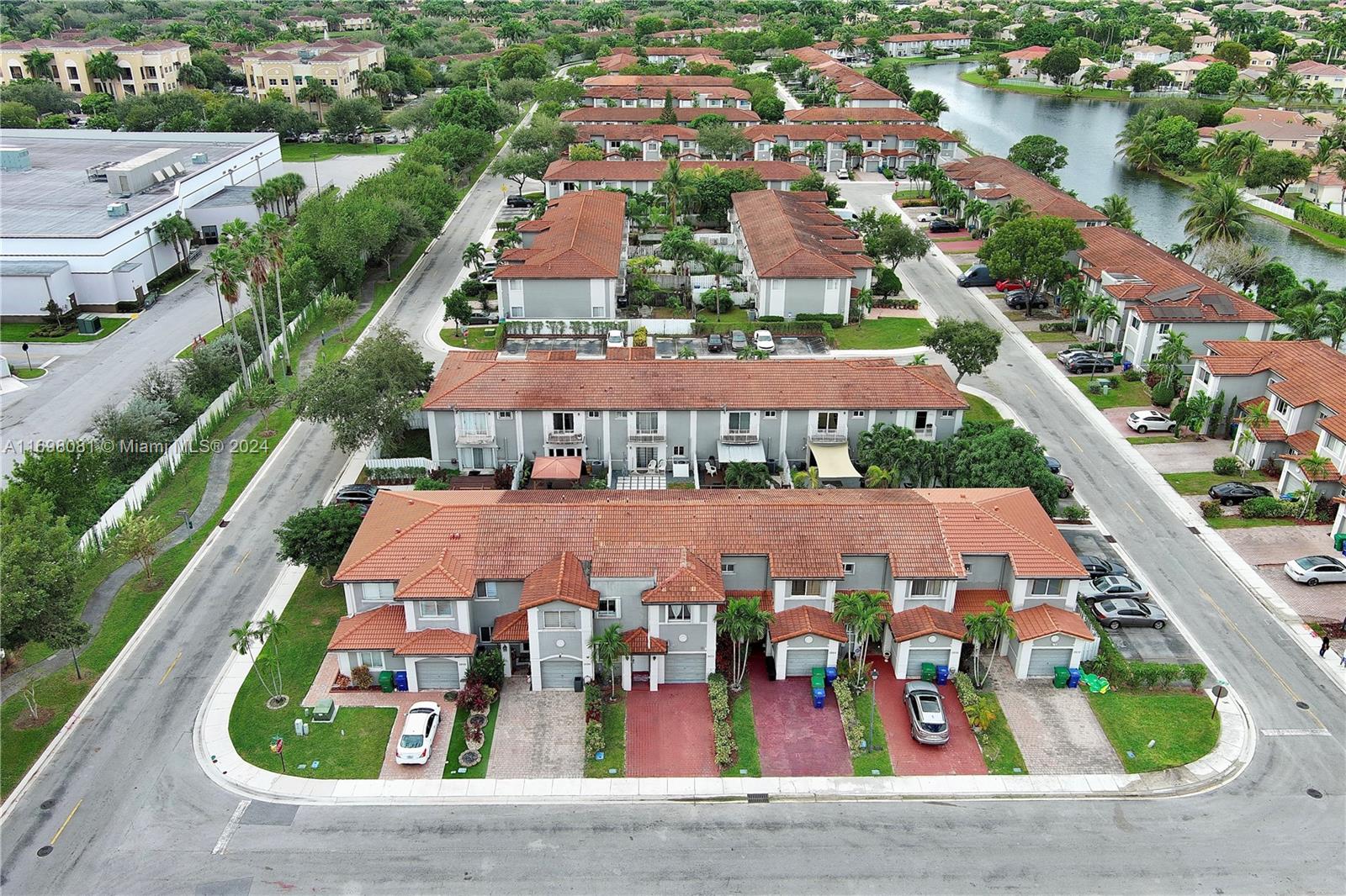 an aerial view of multiple houses with yard