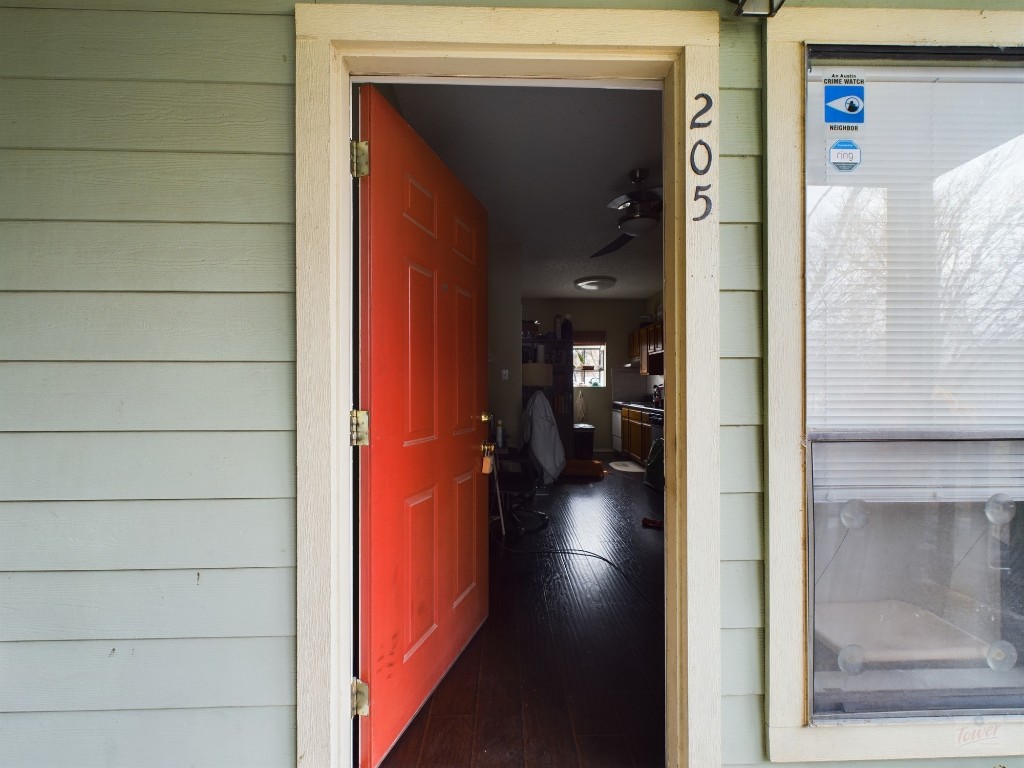 a view of a hallway with a wooden door