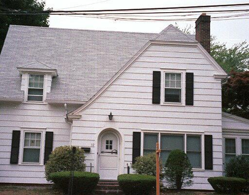 a front view of a house with yard