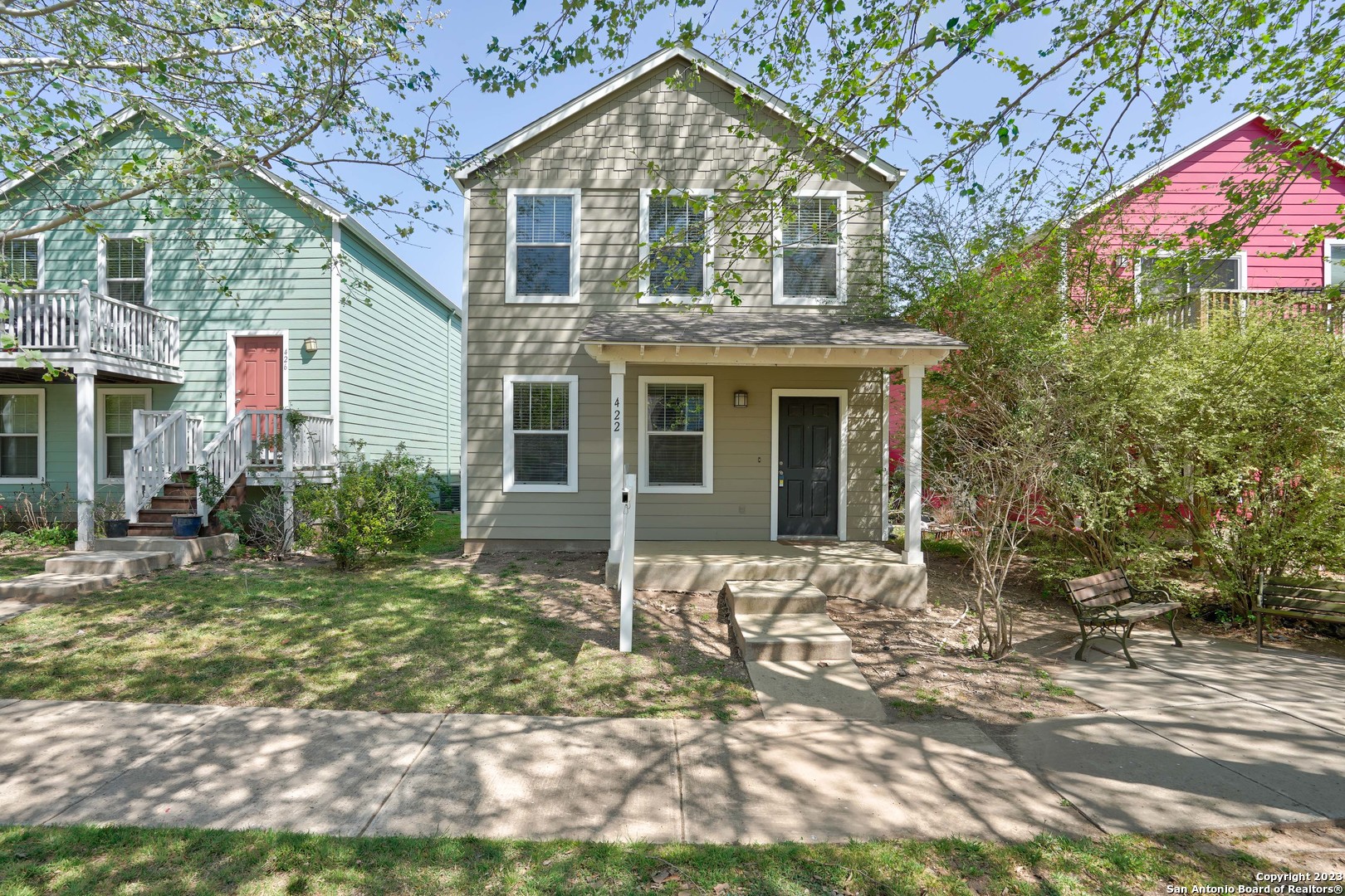 a front view of a house with a yard