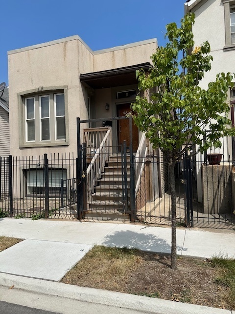 a view of a house with a tree