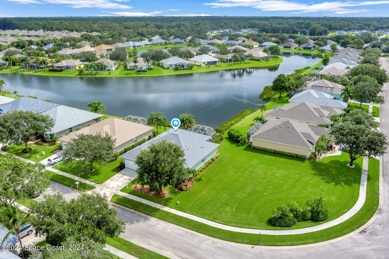 an aerial view of a house with a lake view