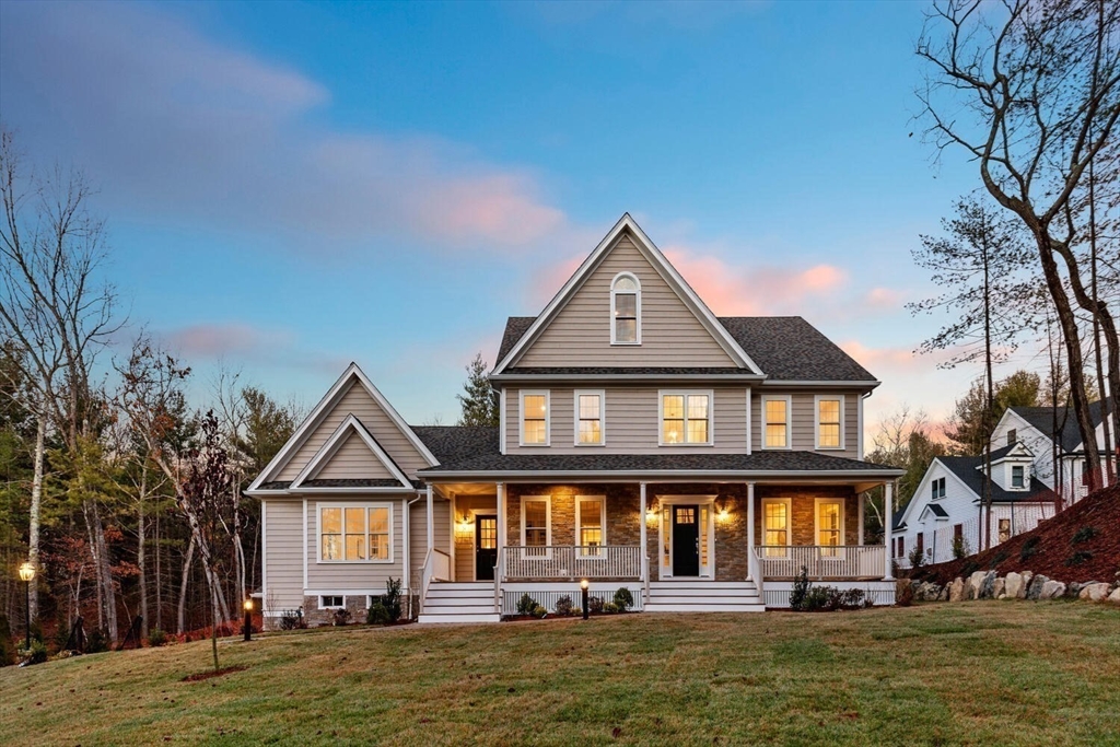 a front view of a house with a yard