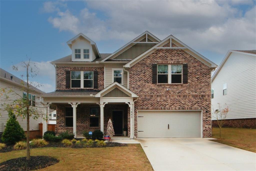 a front view of a house with yard