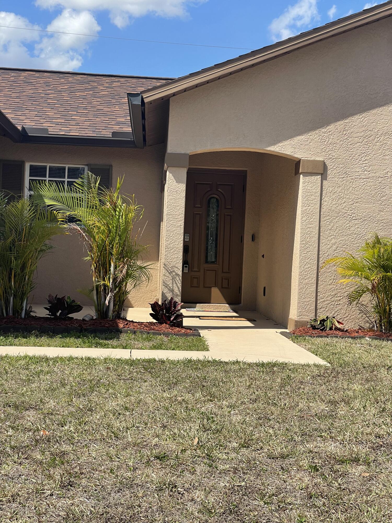 front view of a house with a yard