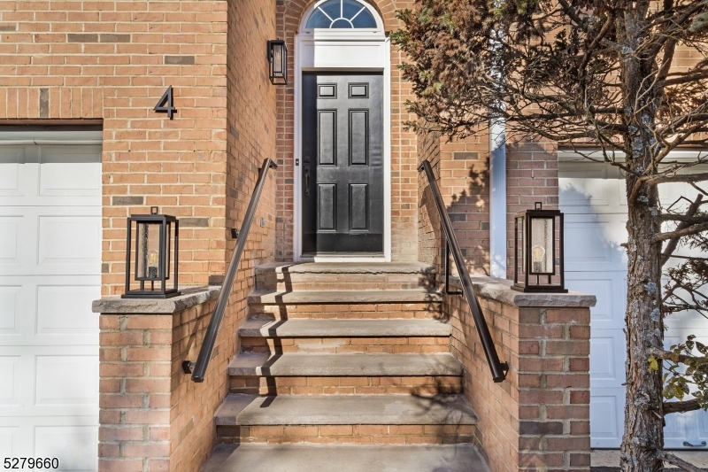 front view of a house with a clock on the wall