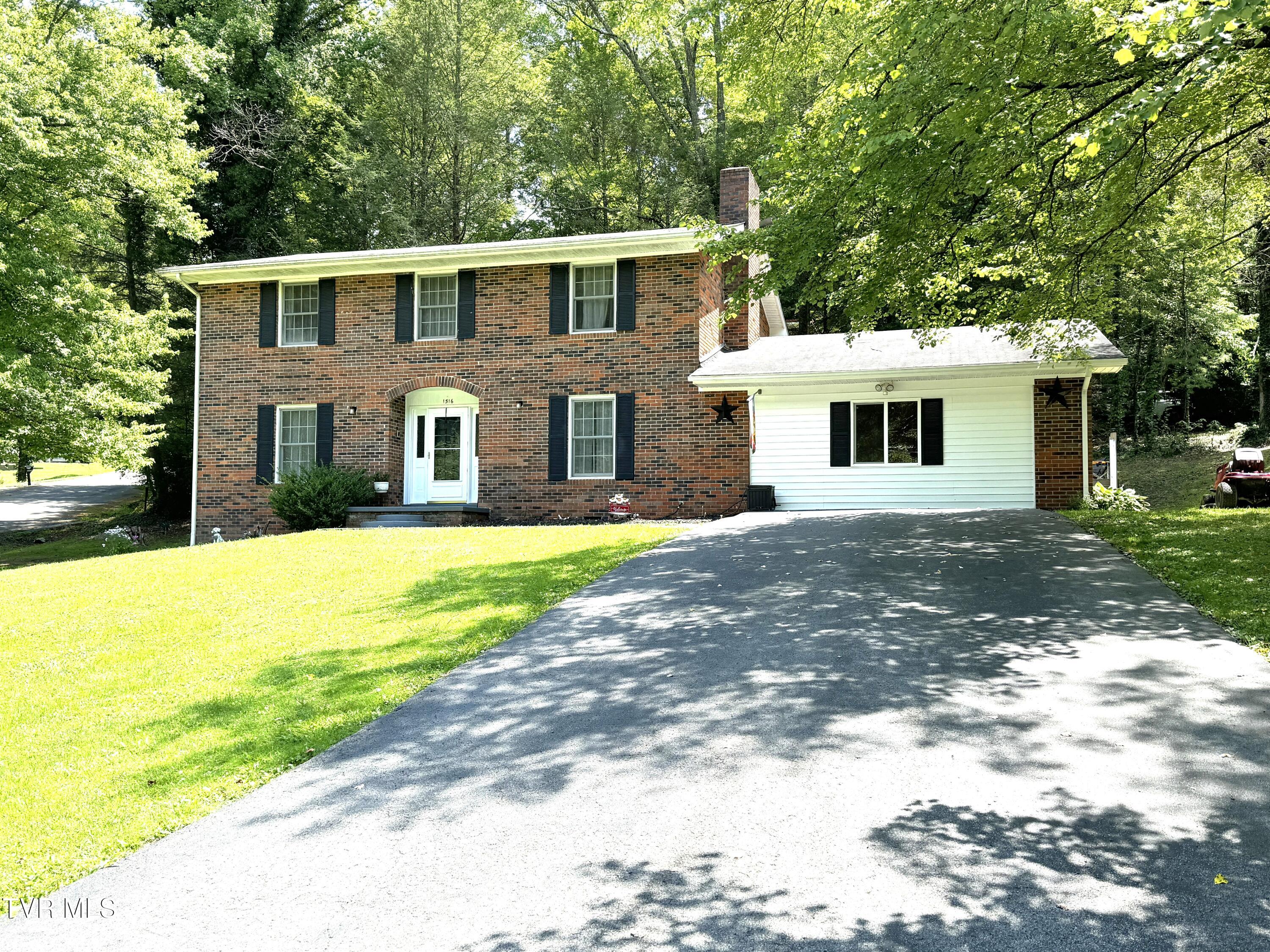 LEFT FRONT VIEW WITH DRIVEWAY