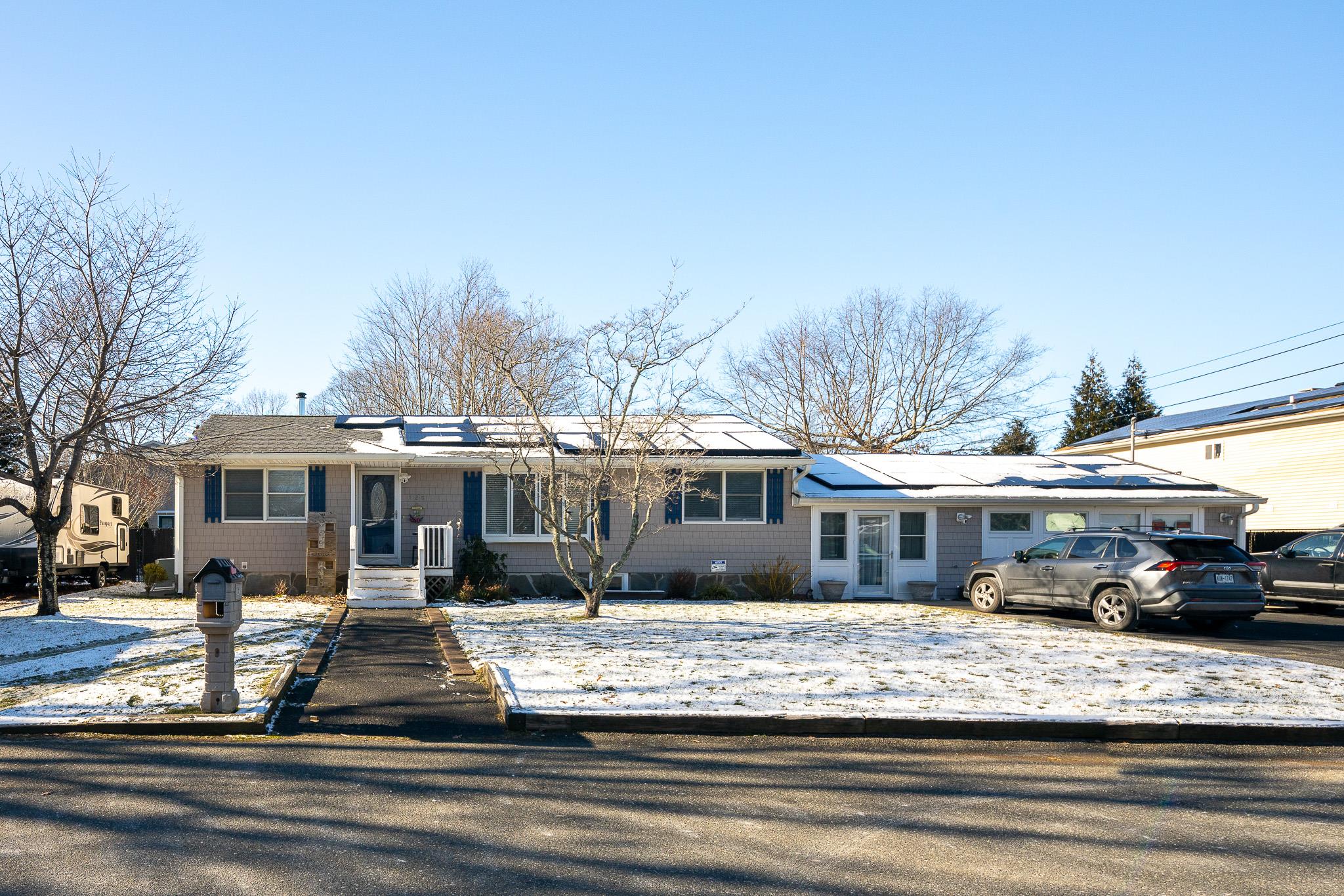 Ranch-style house with solar panels