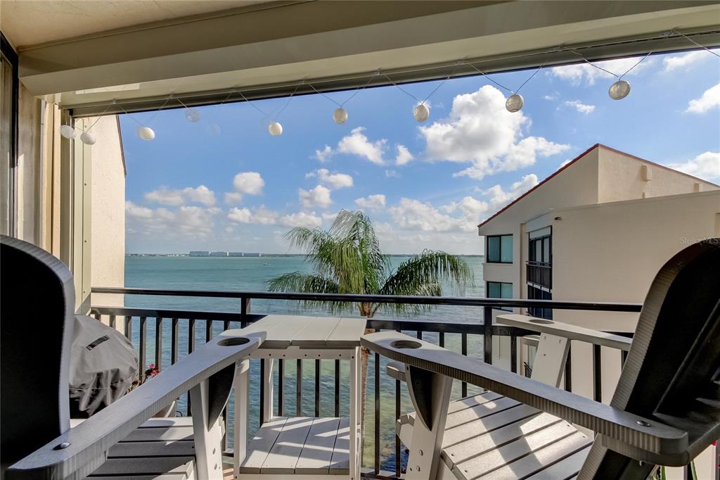 a view of a balcony with furniture