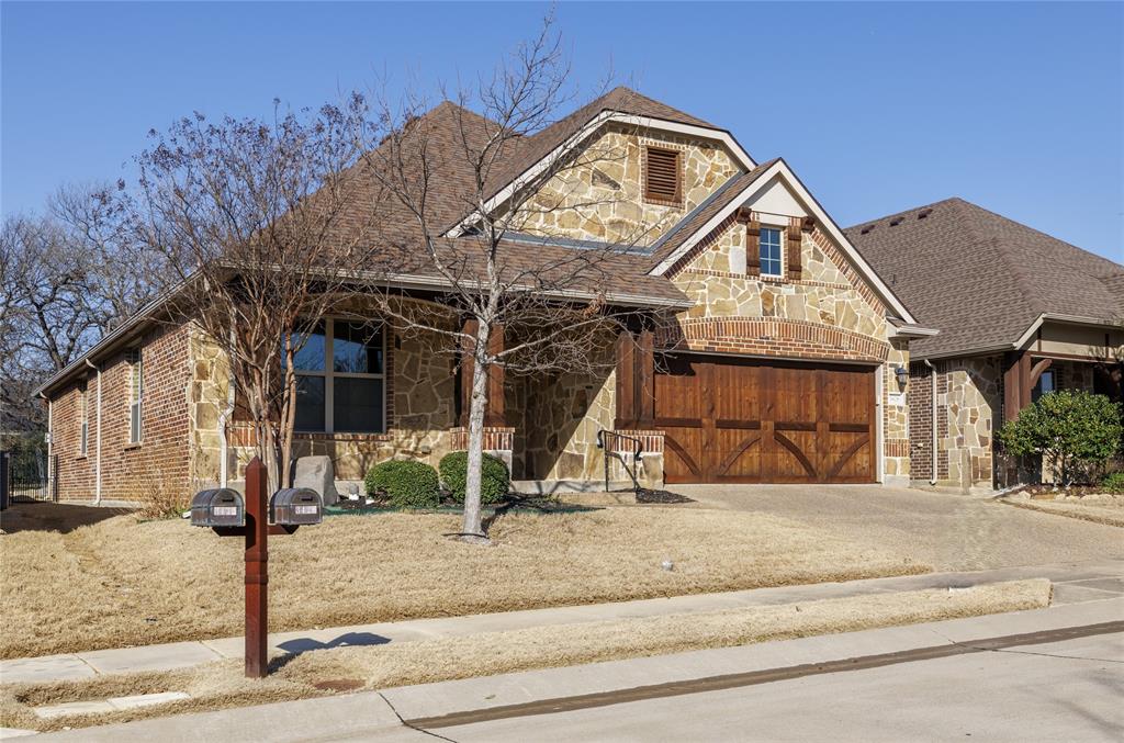 Tuscan style front porch, stone & Cedar garage door