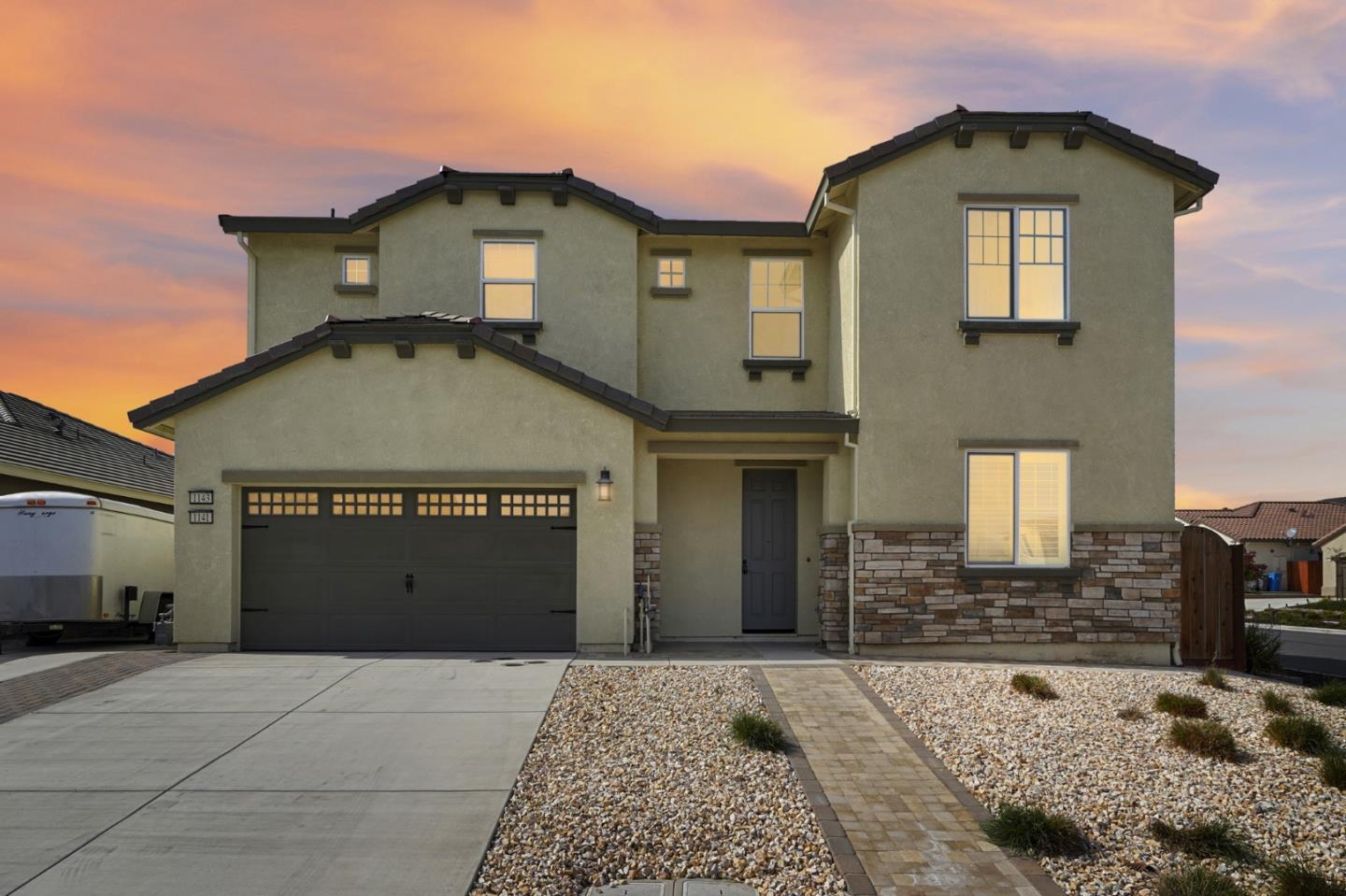 a front view of a house with a garage