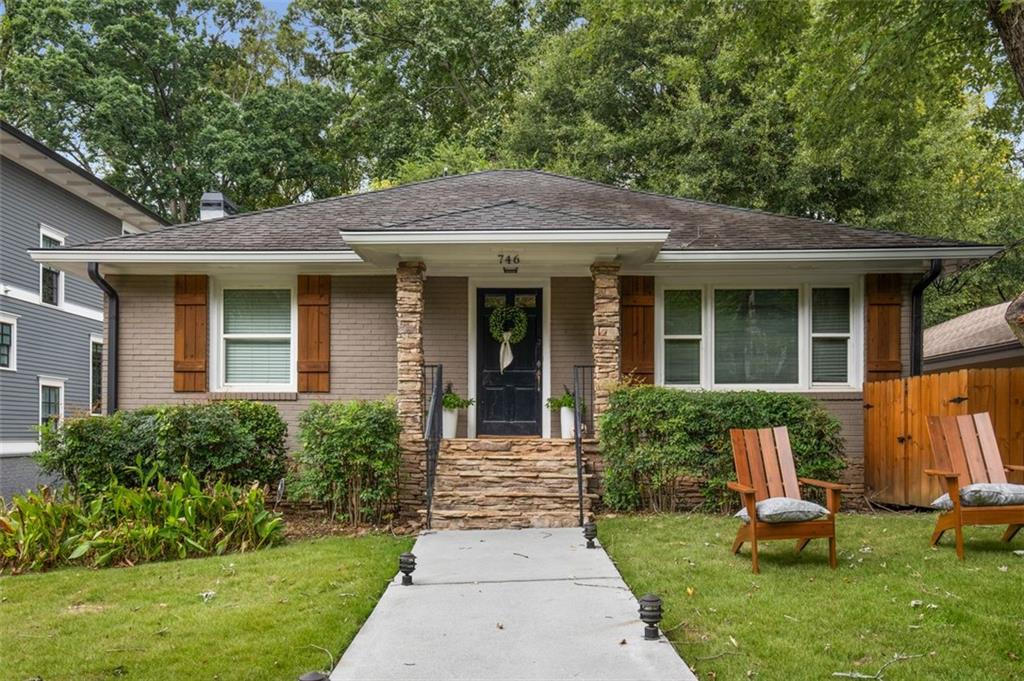 a front view of a house with garden