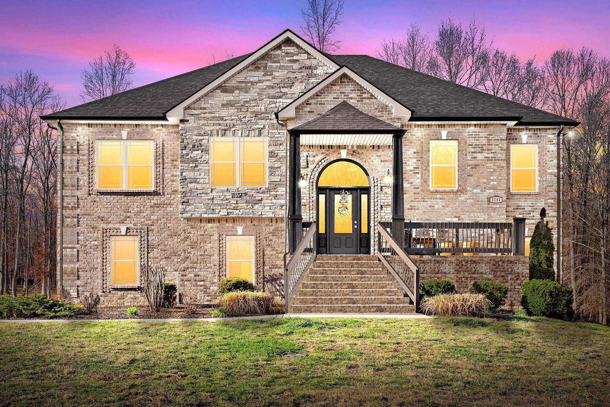 a front view of a house with a yard