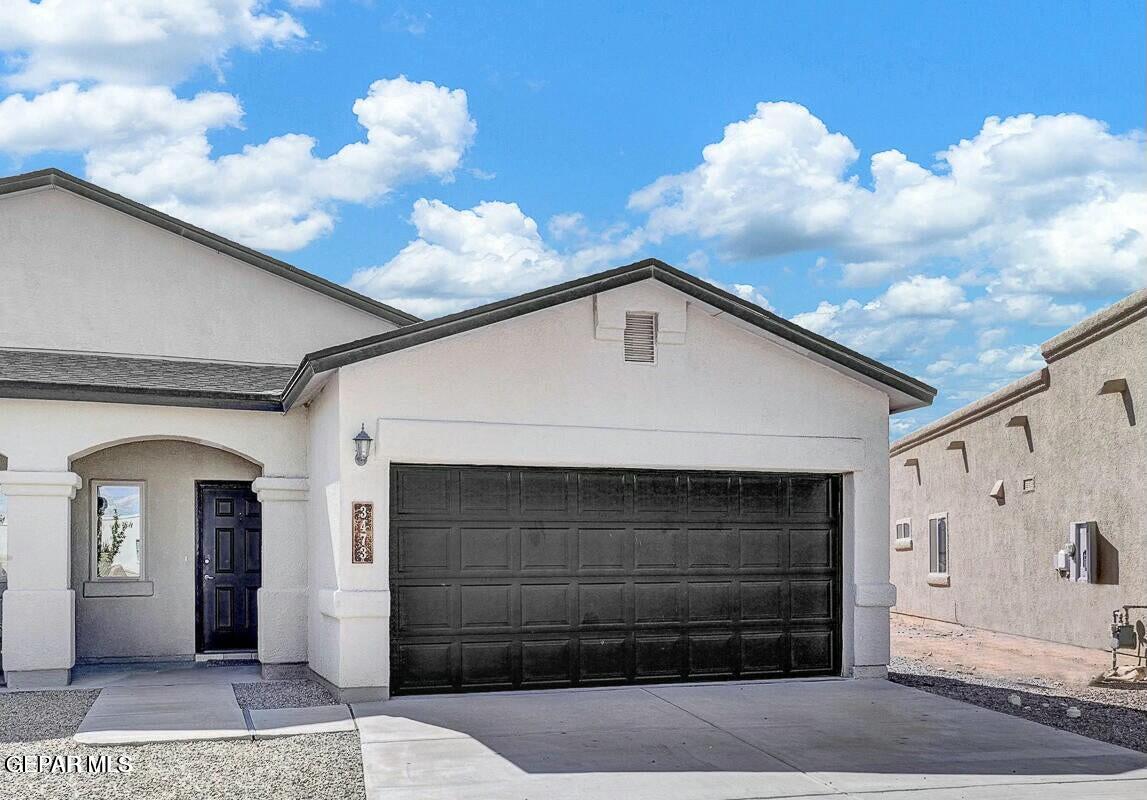 a front view of a house with a garage