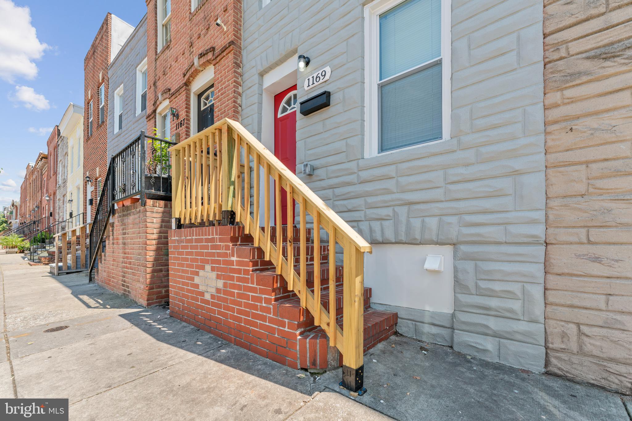 a view of a house with a small yard