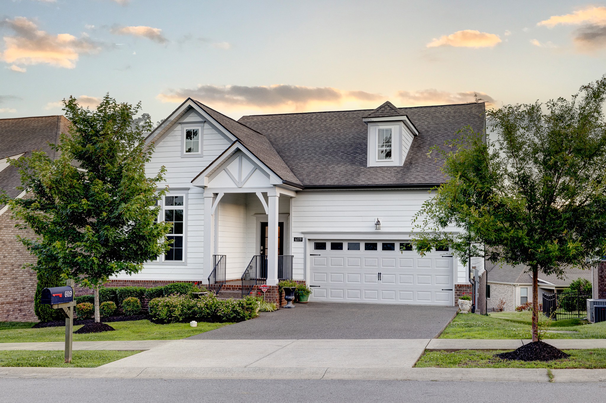 a front view of a house with a yard