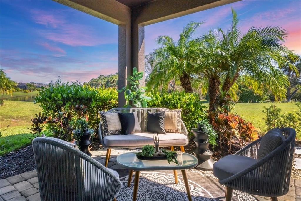 a view of a chairs and table in the patio